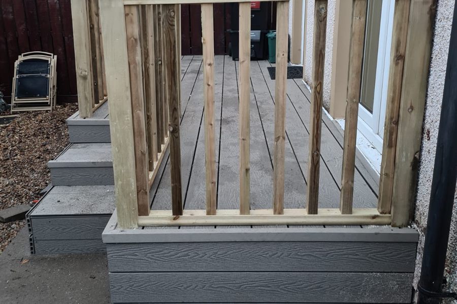 Composite deck with timber balustrade and steps at a back door