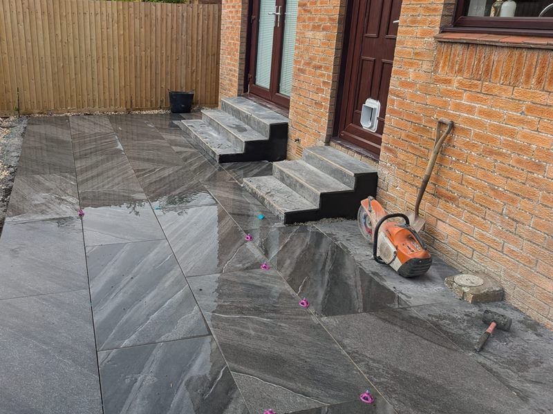 Dark porcelain patio and steps at a back door