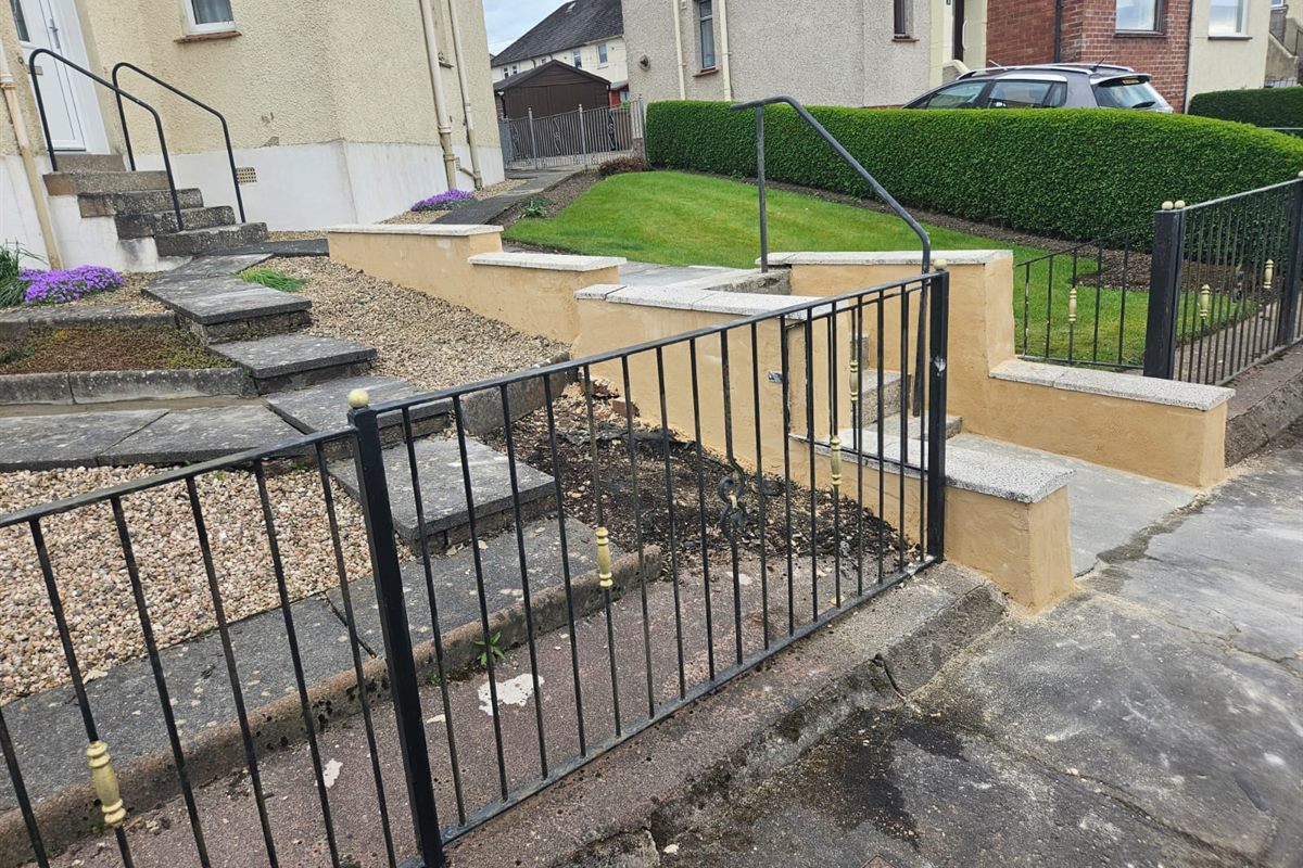Rendered front walls with new copes, steps and black railings