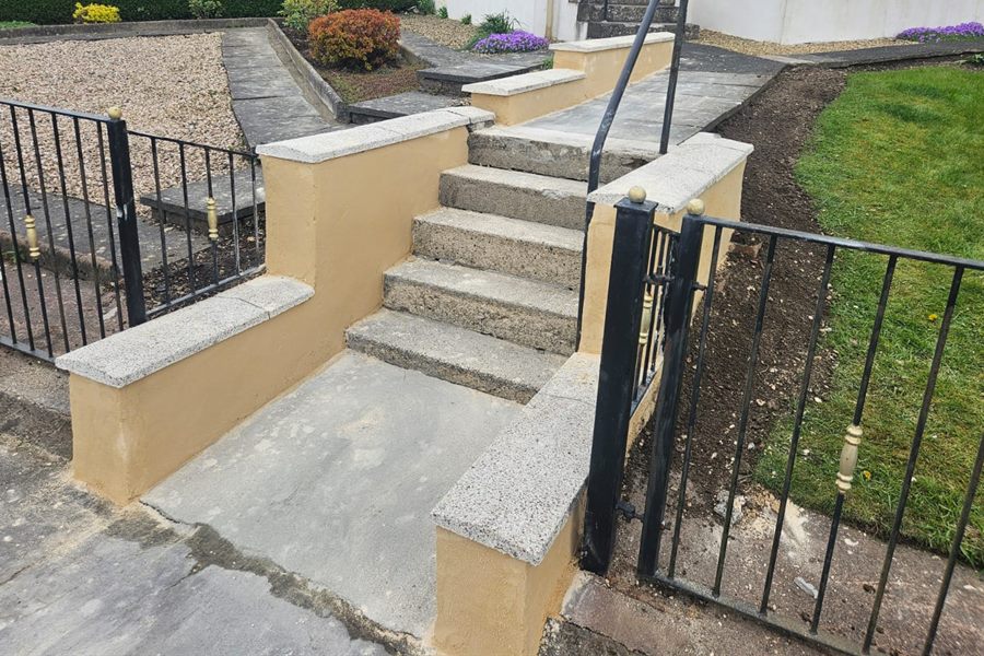 Rendered front steps and walls with new copes and iron railings
