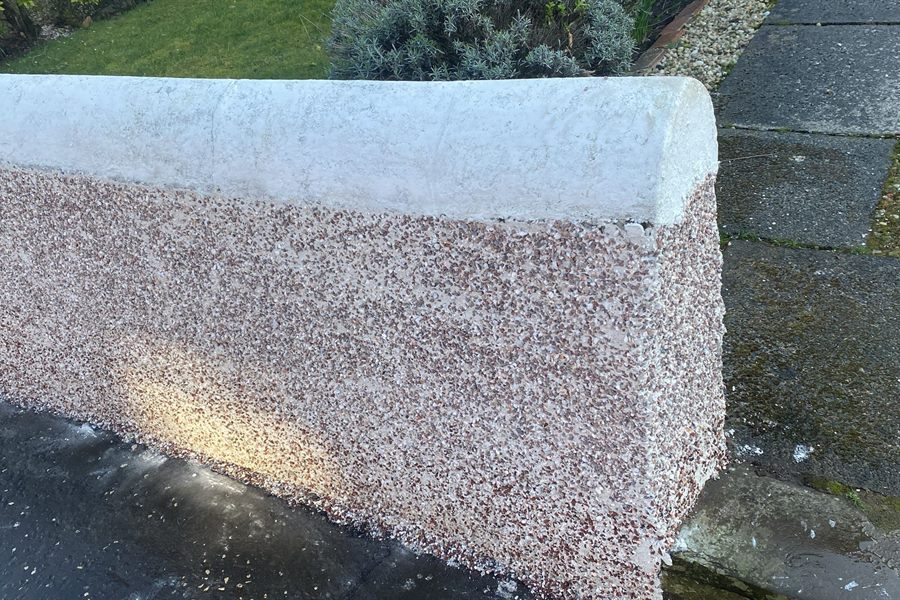 Pebbledash garden wall freshly done with a smooth cope